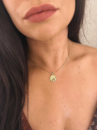 Libra 18K Gold Plated NecklaceOur beautiful 18K gold plated Libra pendant and chain. Made from a stirling silver base with 18K gold plating, the necklace is water resistant and makes the perfect Libra 18K Gold Plated Necklace