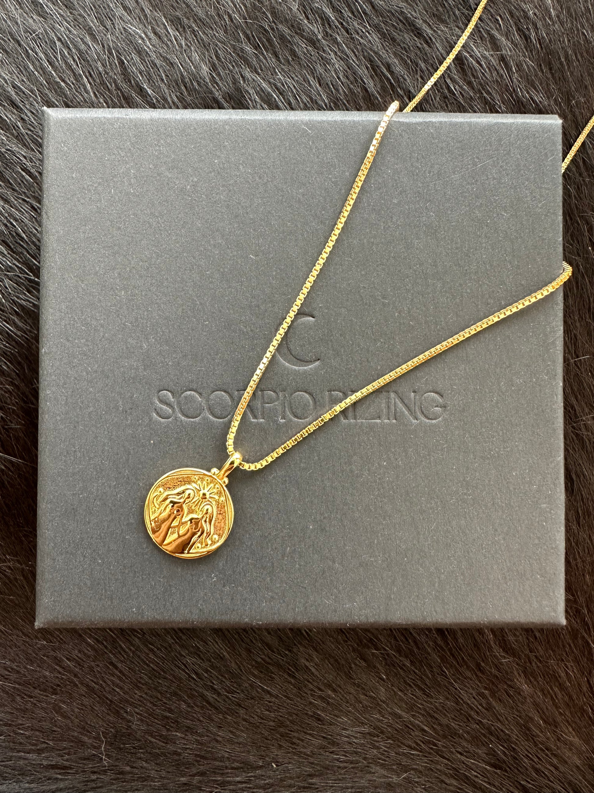 Gemini 18K Gold Plated NecklaceOur beautiful 18K gold plated Gemini pendant and chain. Made from a stirling silver base with 18K gold plating, the necklace is water resistant and makes the perfectGemini 18K Gold Plated Necklace