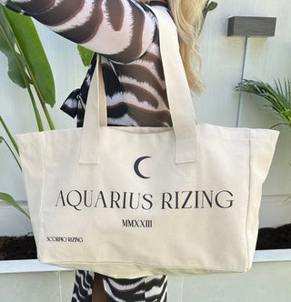 Aquarius Cotton Tote BagAquarius slogan canvas tote bag. 100% cotton. Bag dimensions measure 48cm * 42cm * 40 cm. Cool wash only. Free delivery and returns in the UAE. All prices are inclusAquarius Cotton Tote Bag