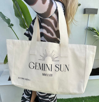 Gemini Cotton Tote BagGemini slogan canvas tote bag. 100% cotton. Bag dimensions measure 48cm * 42cm * 40 cm. Cool wash only. Free delivery and returns in the UAE. All prices are inclusivGemini Cotton Tote Bag