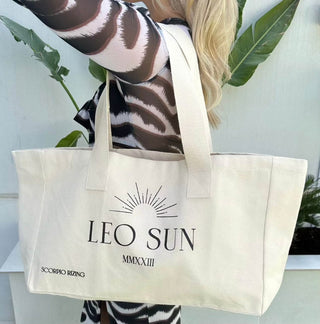 Leo Cotton Tote BagLeo slogan canvas tote bag. 100% cotton. Bag dimensions measure 48cm * 42cm * 40 cm. Cool wash only. Free delivery and returns in the UAE. All prices are inclusive oLeo Cotton Tote Bag