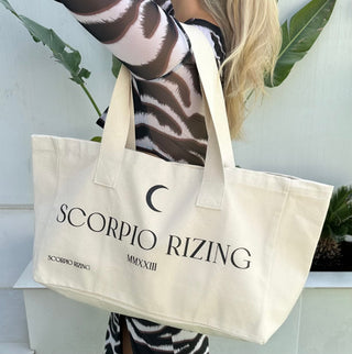 Scorpio Cotton Tote BagScorpio slogan canvas tote bag. 100% cotton. Bag dimensions measure 48cm * 42cm * 40 cm. Cool wash only. Free delivery and returns in the UAE. All prices are inclusiScorpio Cotton Tote Bag